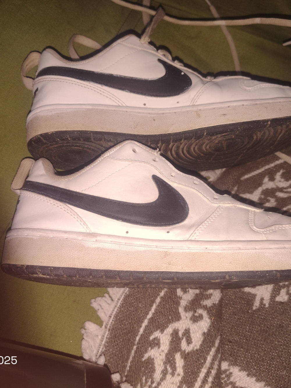 Nike Women’s White Leather Sneakers with Black Swoosh
